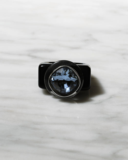 contrast shot of MOUNSER Spectrum Ring in Nox featuring a richly colored acrylic ring band with a sparkling colorful Swarovski crystal.