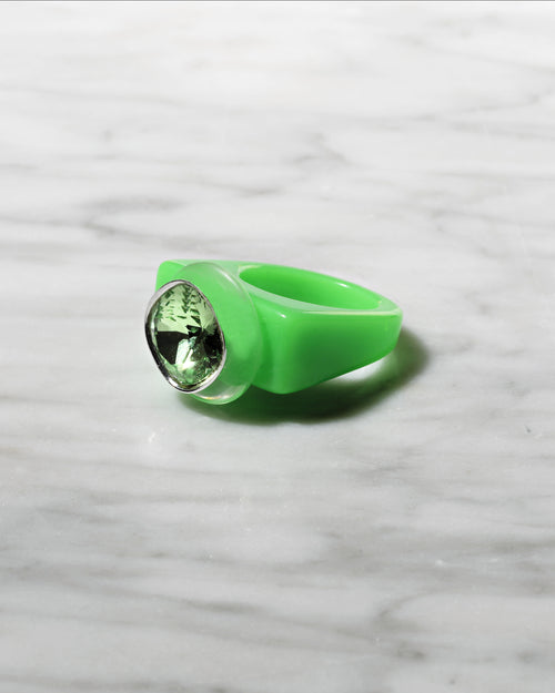 angle shot of MOUNSER Spectrum Ring in Viridescent featuring a richly colored acrylic ring band with a sparkling colorful Swarovski crystal.