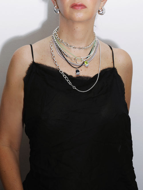 layered shot of MOUNSER XO Chain Necklace in Sterling Silver asymmetric chain necklace that balances delicate wheat chain and silver ball bead chain through trompe l'oeil design