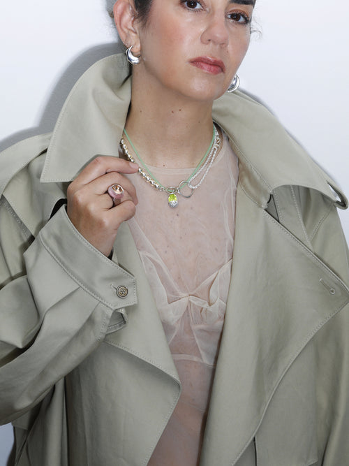 model shot of MOUNSER XO Chain Necklace in Sterling Silver asymmetric chain necklace that balances delicate wheat chain and silver ball bead chain through trompe l'oeil design