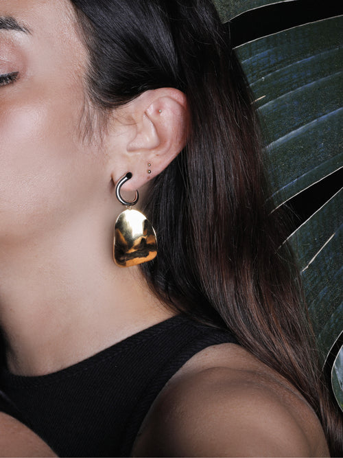 profile shot of MOUNSER Zest Earrings in Gold mixed- metal curved sculptural earring