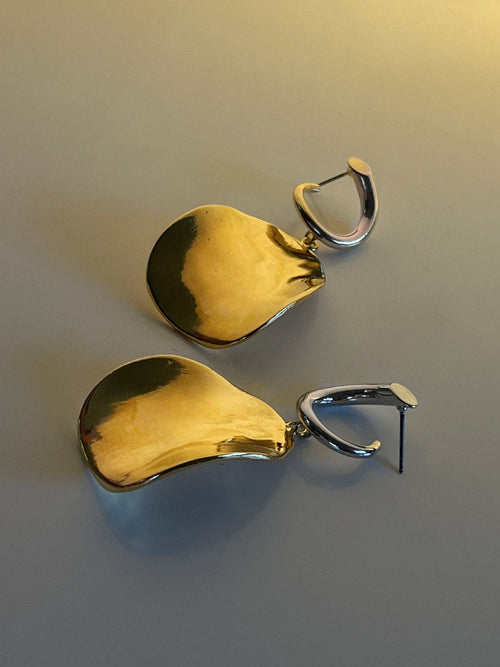 still life shot of MOUNSER Zest Earrings in Gold mixed- metal curved sculptural earring