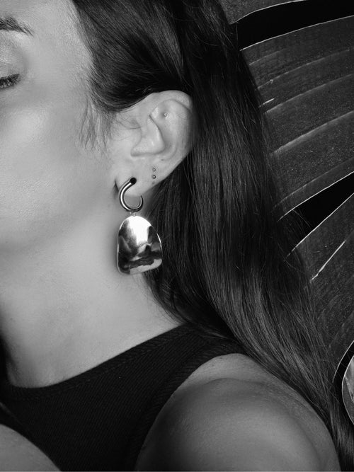 detail shot of MOUNSER Zest Earrings in Silver mixed- metal curved sculptural earring