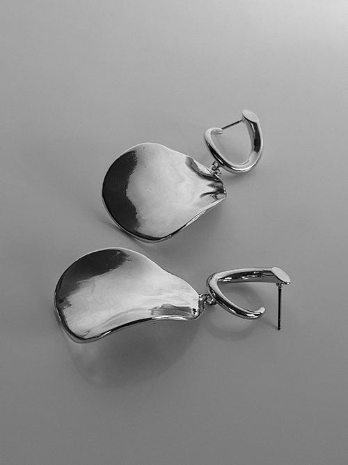 still life shot of MOUNSER Zest Earrings in Silver mixed- metal curved sculptural earring