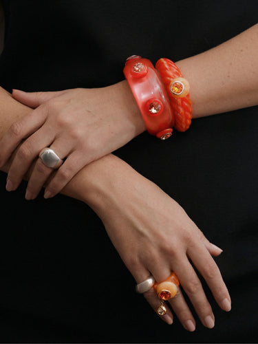 MOUNSER sculptural resin bangles and rings featuring Swarovski crystal and natural gemstone details.