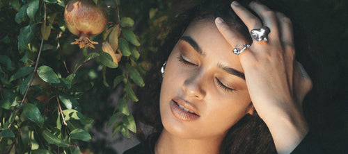 Model wearing MOUNSER sculptural sterling silver rings.  Art object jewelry handcrafted in Los Angeles.