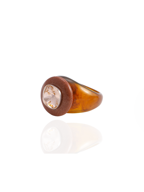 Side profile of the MOUNSER Bliss Ring in Clay showing its domed shape and milky brown resin band with goldstone accent.