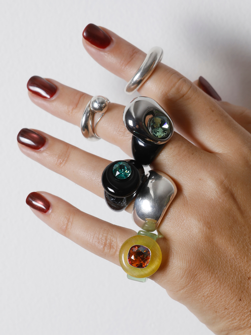 MOUNSER Orbital Ring in Charcoal worn with ring stack, styling a black gemstone ring.