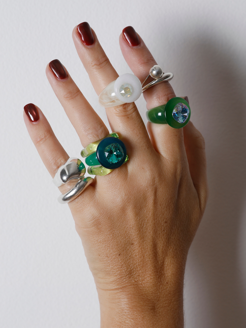 MOUNSER Orbital Ring in Griege worn with ring stack, styling a white gemstone ring.