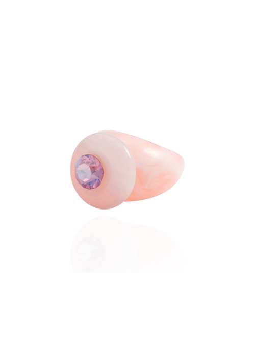 Side profile of the MOUNSER Orbital Ring in Pink Aurora showing the pink rose quartz gemstone disc and milky marbled resin band.