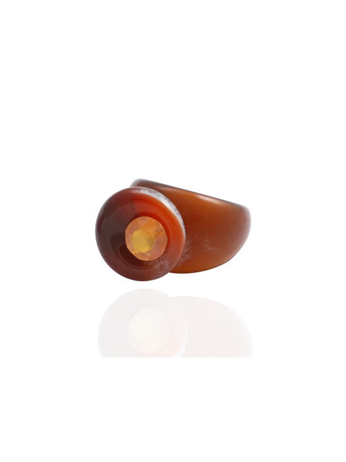 Side profile of the MOUNSER Orbital Ring in Terra showing the carnelian gemstone disc and milky marbled resin band.