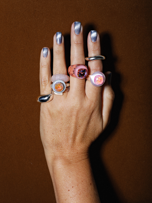 On hand shot of MOUNSER Raw Gradient Cellophane Ring in Sweet Dream featuring a cushion-cut Austrian crystal and acrylic resin band