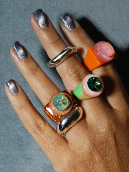 Alternate shot of MOUNSER Raw Gradient Ring Pop in Gilded Energy worn on hand showing sculptural resin band and crystal center stone