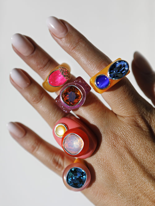 Close-up of MOUNSER Ring Pop in Coulis with acrylic resin band and Austrian crystal stone