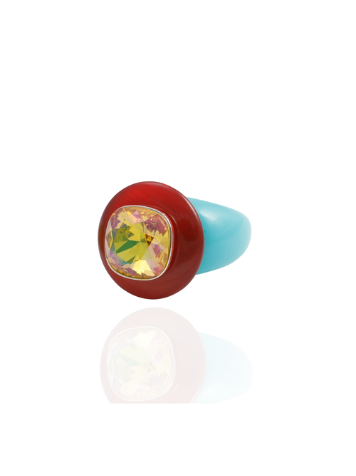 Side profile of the MOUNSER Ring Pop in Starfish showing its sculptural shape and opaque red and turquoise acrylic resin band.