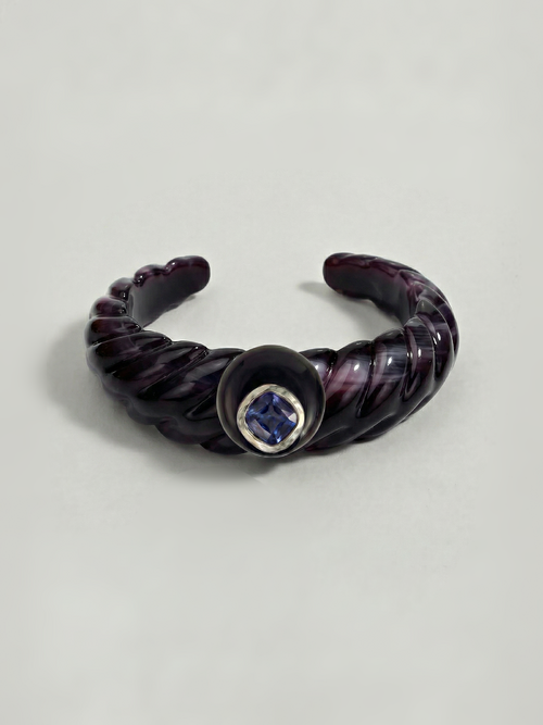 MOUNSER Scallop Cuff in Abyss - deep purple sculptural resin open cuff bracelet with obsidian disc and sapphire Austrian crystal in rhodium-plated hammered setting on neutral background