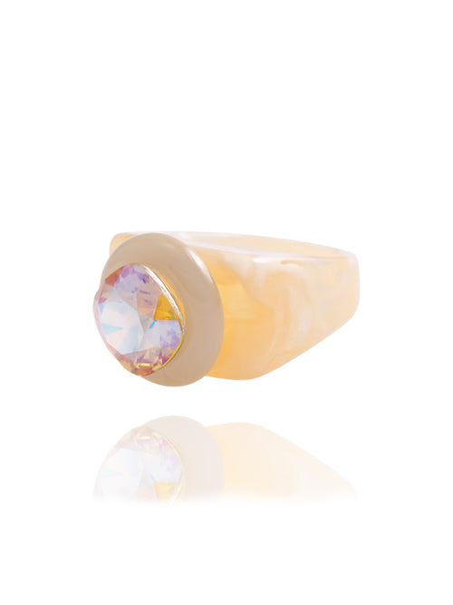 MOUNSER Spectrum Ring in Blonde— side profile view of light peach acrylic resin sculptural statement ring with iridescent crystal set in diamond position, handcrafted in Los Angeles.