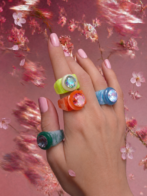 MOUNSER Spectrum Ring in Sleeping Beauty worn on model's hand — blue limited edition cocktail ring with iridescent Austrian crystal on a coral floral background,  art object jewelry handcrafted to order in Los Angeles.