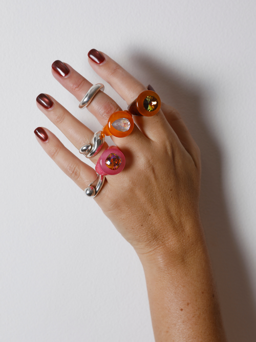 Hand wearing the MOUNSER Tears of Joy Ring in Fresh Squeezed on the finger in a ring stack, showing the statement ring’s size and scale.
