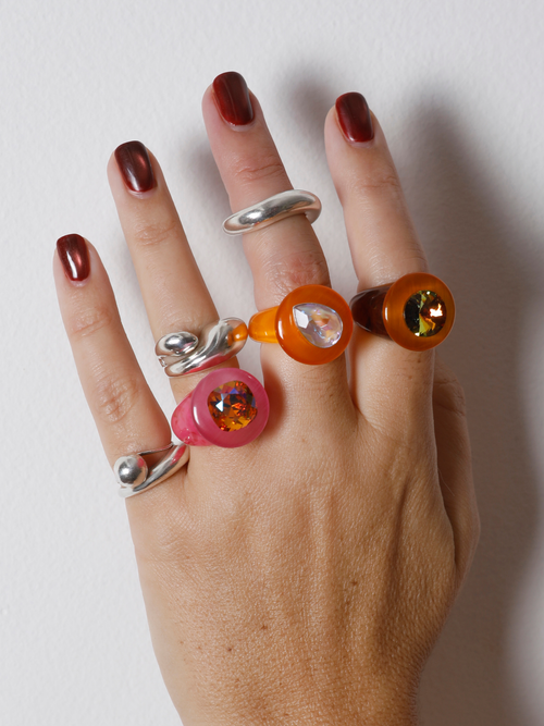 MOUNSER Tears of Joy Ring in Fresh Squeezed worn with colorful acrylic rings and sterling silver, styling bold resin statement rings.