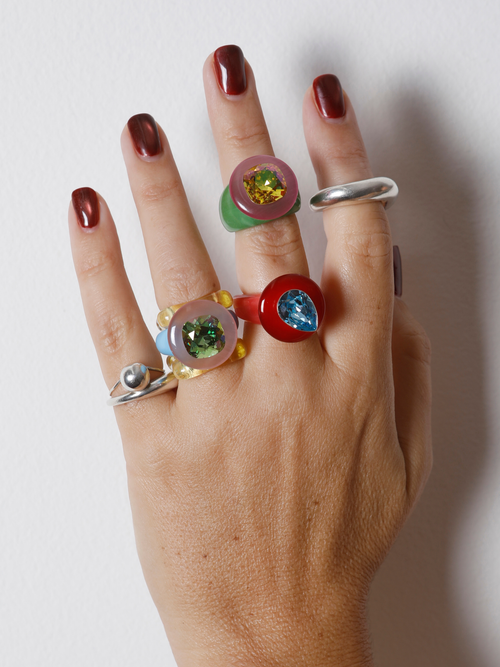 Hand wearing the MOUNSER Tears of Joy Ring in Wedgewood on the finger in a ring stack, showing the statement ring’s size and scale.