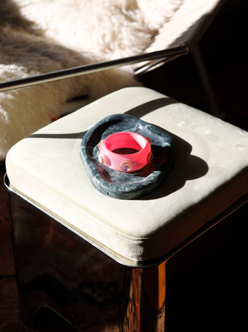 still life shot of the MOUNSER Ambrosia Bangle displaying its domed sculptural silhouette and glossy finish.