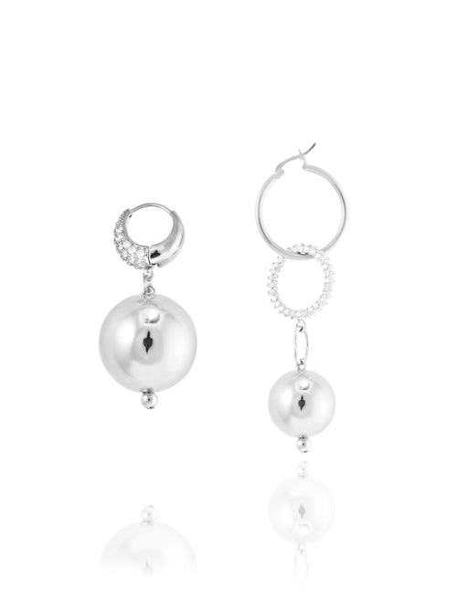 MOUNSER Full Moon Continuum Hoops in Silver Sculptural mismatched hoop earring pair with ball drops.