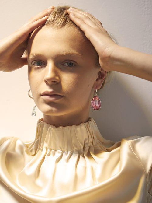 studio shot of MOUNSER Sunset Earrings mismatched asymmetric hoop earrings with colorful crystal drops