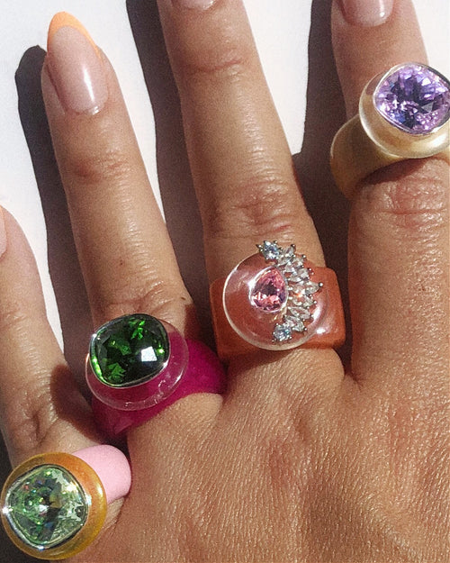 Hand shot of MOUNSER Ring Pop in Sangria candy colored crystal cocktail ring